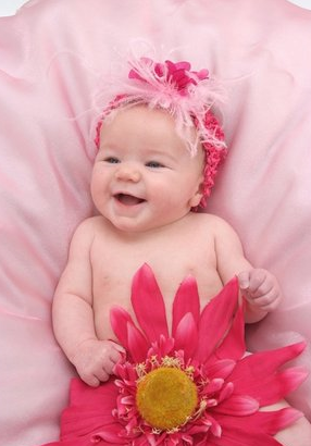 baby-girl-photo-shoot-picture-a-happy-baby-girl-hugging-a-big-pink-flower